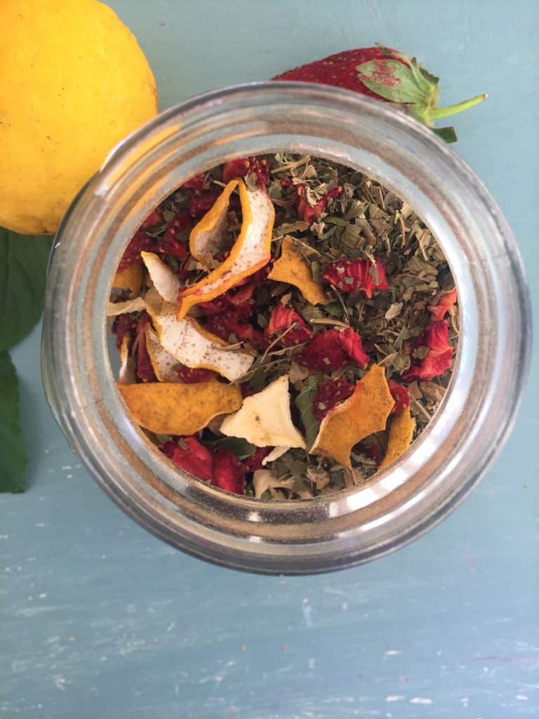Dehydrated strawberry, lime and mint tea in a glass jar