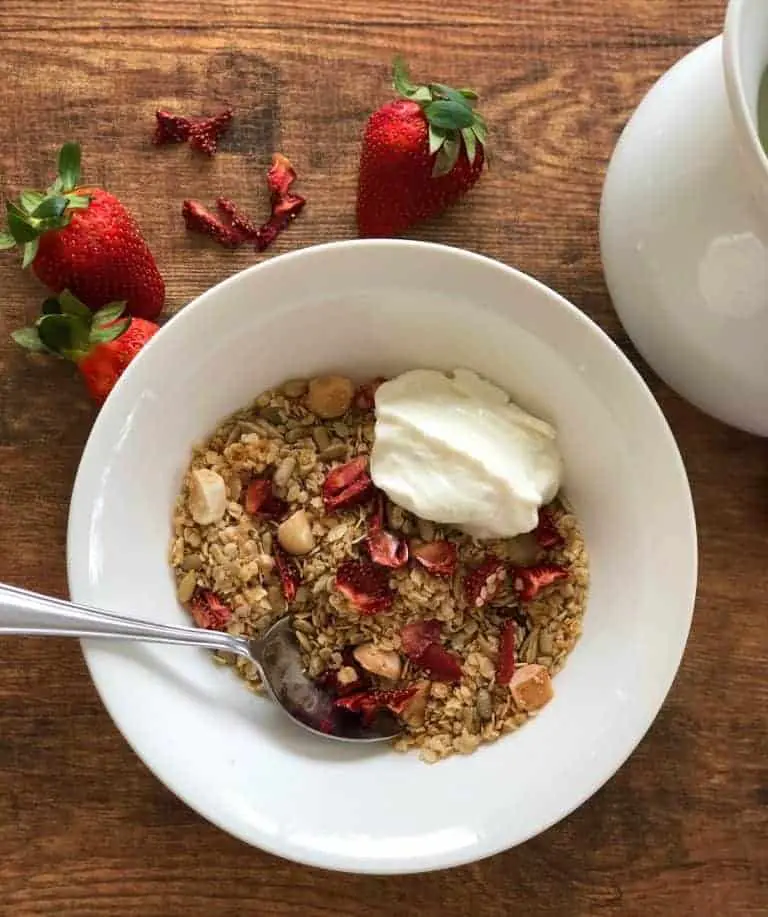 a bowl of toasted muesli with strawberries