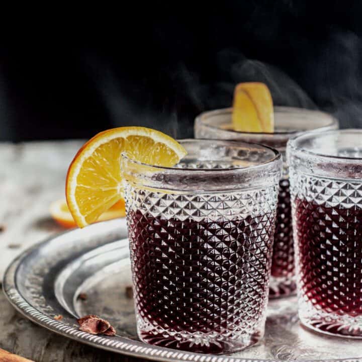 steaming mulled wine with orange slices.