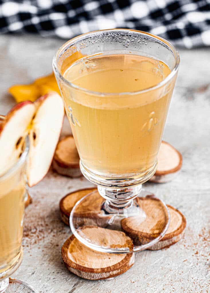 warm mulled apple juice in tall glasses