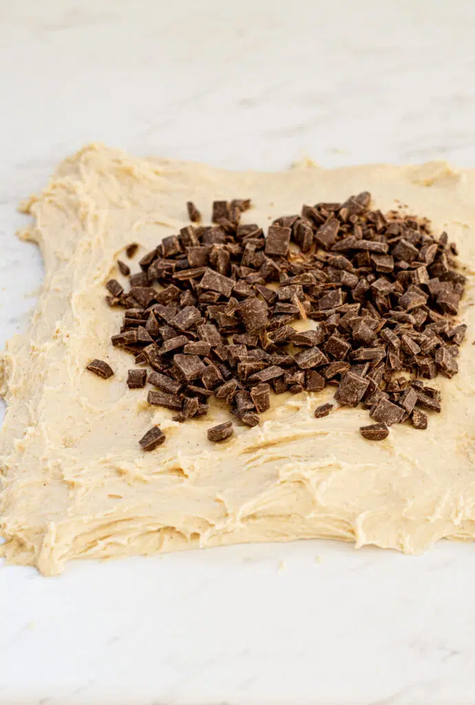 chocolate chips spread on dough