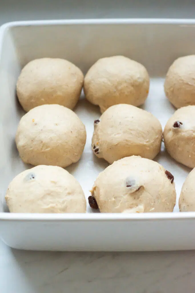 balls of dough in a white tray