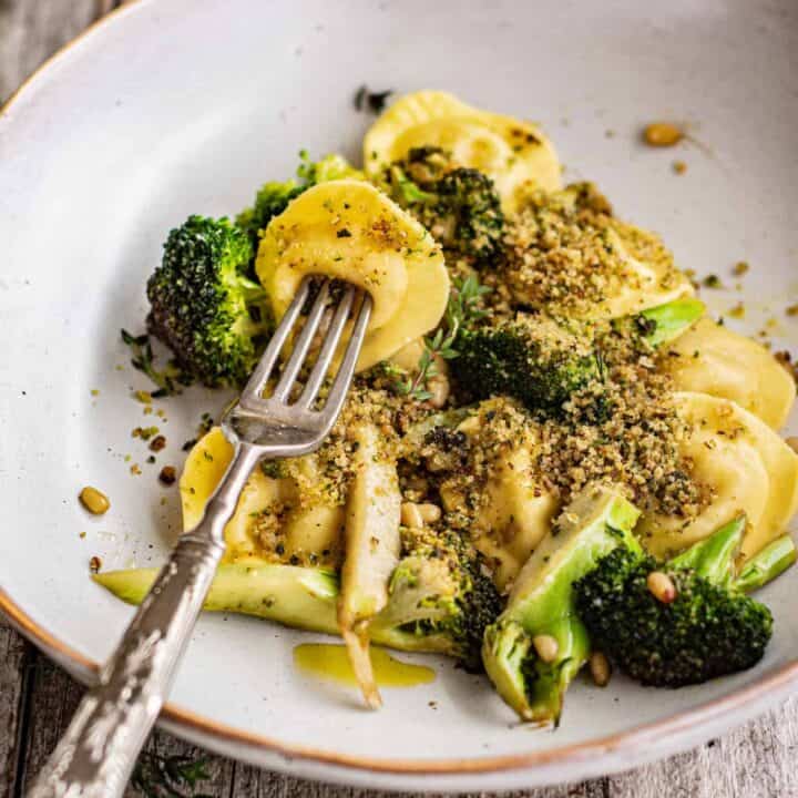 pasta with broccoli on a fork,