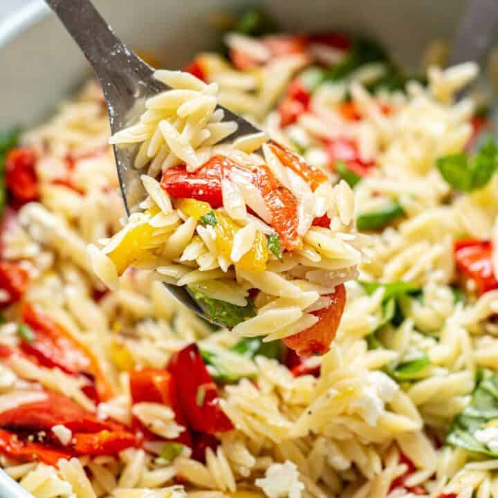 orzo salad with a spoon.